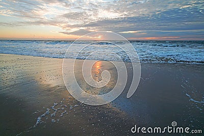 Tranquility scene, beautiful tropical beach sunset in light pink and blue colors with beautiful sun reflection Stock Photo