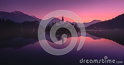 Tranquility Winter Rising Of The Sun At Lake Bled, Slovenia.Windless Reflection Church of Mary the Queen, Parish Church Of St.Mar Stock Photo