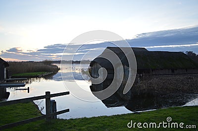 Tranquillity at the Hickling Broad Norfolk Thatched Boathouses Stock Photo