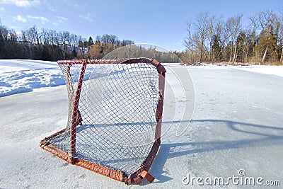 Tranquillity scene of hockey rink in the frozen lake Stock Photo