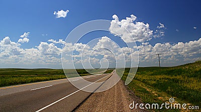Trans-Canada Highway heading west of Calgary, Alberta, Canada - An Endless road / journey / roadtrip / adventure Stock Photo