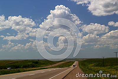 Trans-Canada Highway heading west of Calgary, Alberta, Canada - An Endless road / journey / roadtrip / adventure Stock Photo