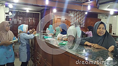 Transaction in jewelry store. Sale and customer service in the store. Editorial Stock Photo