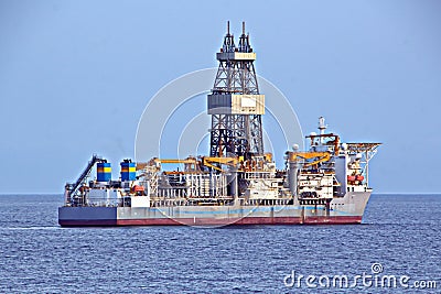 Transhipment terminal for discharging cement cargo by shore cranes. A view of berths with cargo ships and the water area of the po Stock Photo