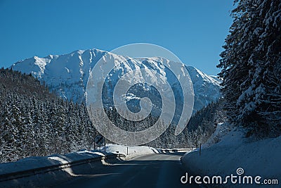 Transit route upper bavaria to austria, tirolean winter landscape Stock Photo