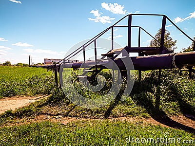 Transition, stairs, grass, blue sky, heating line, city Stock Photo