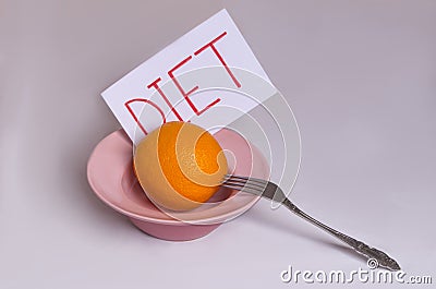 Transition to proper nutrition Word diet on a white background with an orange in a plate Stock Photo