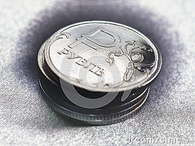 Translation of the inscription: ruble. Stack of Russian coins. Above there is a 1 ruble coin with the symbol of the national Cartoon Illustration