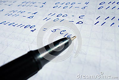 Translations of calculus systems on a notebook and black pen. creation of computer programs. work of the programmer and Stock Photo