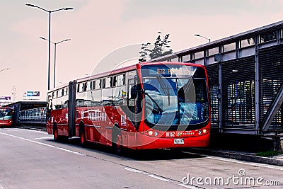 Transmilenio bus stopping at the station Editorial Stock Photo