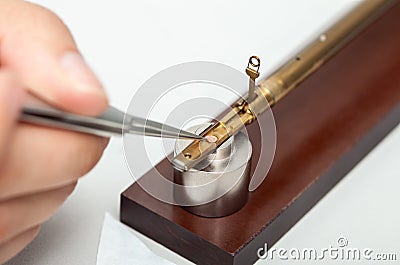 Transmission electron microscope sample holder been loaded with an specimen on a grid Stock Photo