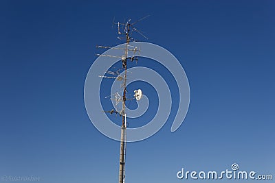 A Transmitter in the blue winter sky Stock Photo