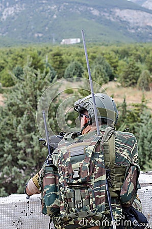Transmitter radio operator gunner M249 light machine gun Stock Photo