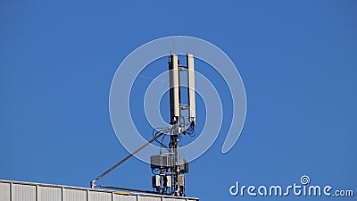 Transmitters of radio signals. electric network. Ecology of power. Technical pole. Iron construction on a blue sky. Strategic reso Stock Photo