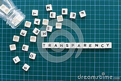 Transparency word made of square letter word on green background. Stock Photo