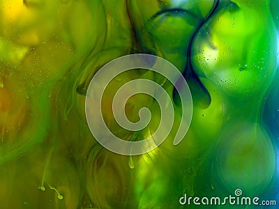 Transparent ball under water, green yellow ink Stock Photo