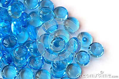 Transparent blue glass marble beads isolated on white background Stock Photo