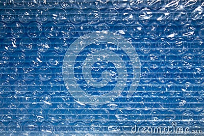 Transparent blue plastic bubble wrap for packaging shipping and transport security protect from hits or dents Stock Photo