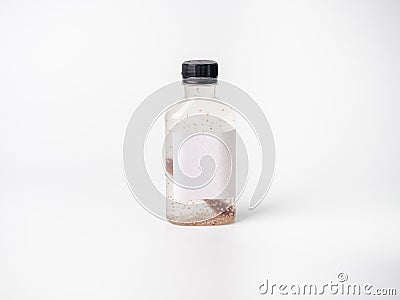 Transparent clear color drink in plastic bottle container with empty logo label. mixed many vegetables and fruits smoothie juice o Stock Photo