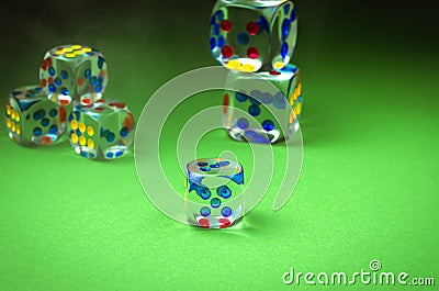 Transparent cubes for casino/transparent cubes for casino are scattered on green cloth Stock Photo