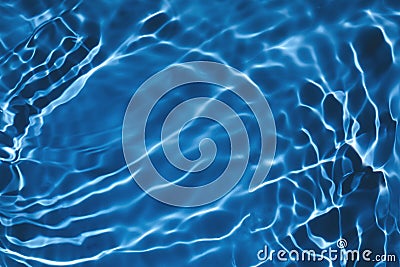 Transparent dark blue colored clear calm water surface texture Stock Photo