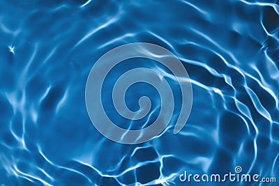 Transparent dark blue colored clear calm water surface texture Stock Photo