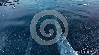 Transparent dark blue ice of Lake Baikal, close-up Stock Photo