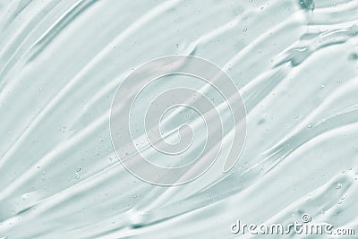Transparent gel texture. Hand sanitizer, face serum, eye cream smear background Stock Photo