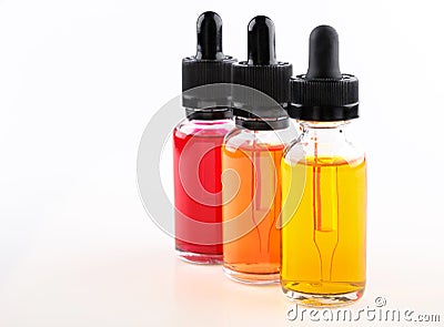 Transparent glass bottles filled colored liquid with dropper Stock Photo