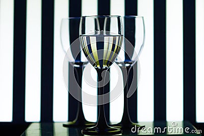 Glass glasses on the background strips Stock Photo