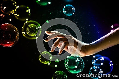 The transparent, iridescent soap bubbles isolated on black. Stock Photo