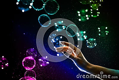 The transparent, iridescent soap bubbles isolated on black. Stock Photo