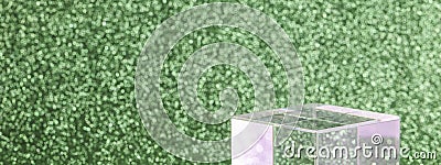 transparent podium for product display on green glittering background. Stock Photo