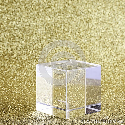transparent podium for product display on yellow glittering background. Stock Photo