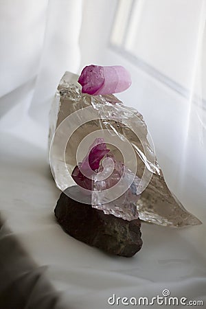 Transparent quartz crystal and purple crystals Stock Photo