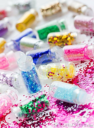 Transparent small bottles with glitter makeup and nail art Stock Photo