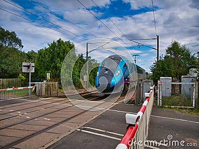 A Transpennine Express train travelling at speed in Northumberland, UK Editorial Stock Photo