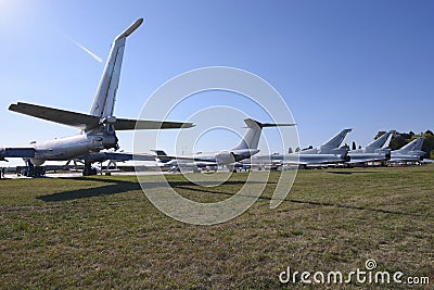 Transport aircrafts and light planes parked in the park of an air show Editorial Stock Photo