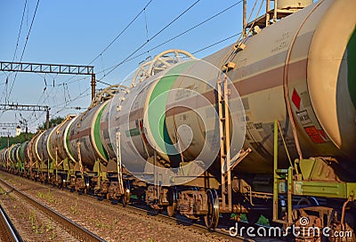 Transport tank car LNG by rail, gas-oil products. LPG transport propane. The fuel train, rolling stock with petrochemical tank Editorial Stock Photo