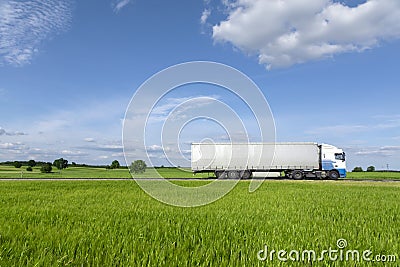 Transport truck driving on the road Stock Photo