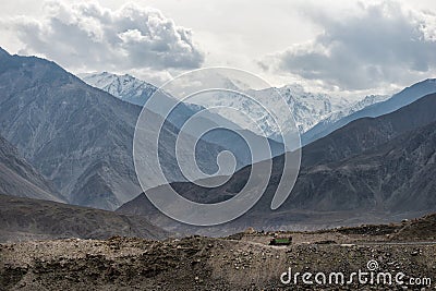 Transport trucks drive through the streets in the mountains Stock Photo