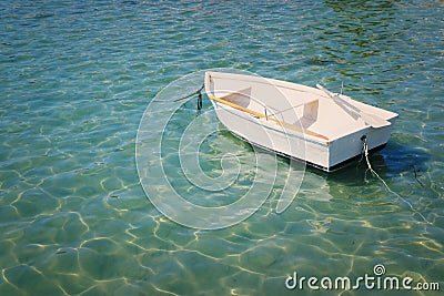 Transportation image of little white boat in the beautiful sea Stock Photo