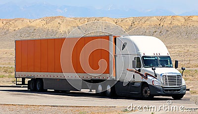 Transportation luxe semi truck trailer on scenic highway. Stock Photo
