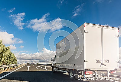 Transportation of merchandise on the road in a small truck Stock Photo