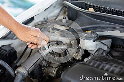 Transportation repair service concept, Repairman auto mechanic check for damage inside engine. man worker service engine mechanic Stock Photo