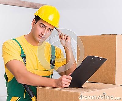 Transportation worker delivering boxes to house Stock Photo