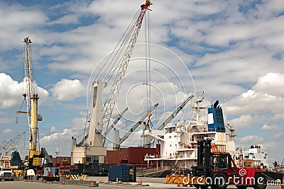 Transshipment terminal for loading steel products to sea vessels using shore cranes and special equipment in Port Pecem, Brazil, Editorial Stock Photo