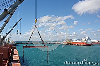 Transshipment terminal for loading steel products to sea vessels using shore cranes and special equipment in Port Pecem, Brazil, Editorial Stock Photo