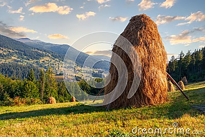 Transylvanian mountains with typical bales on the hillside, Bihar mountains, Carpathian mountains at sunrise Stock Photo