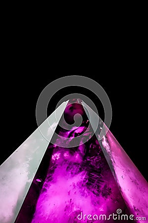 trapiche polished amethyst pyramide on black background Stock Photo